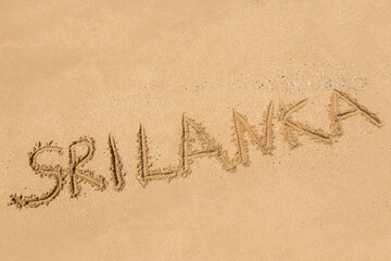 Sri Lanka written in a sandy