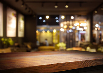 Empty wooden table with bokeh and blur restaurant background, for your photo montage or product display, Space for placing items on the table, product and food display.	