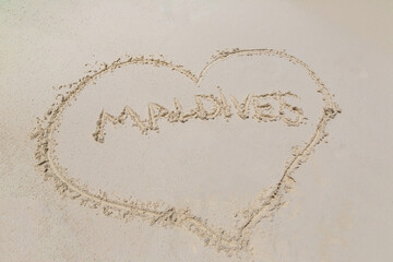 Heart drawn on sand at Maldives