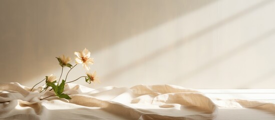 Neutral beige linen texture pleated tablecloth with floral shadows and copy space - obrazy, fototapety, plakaty