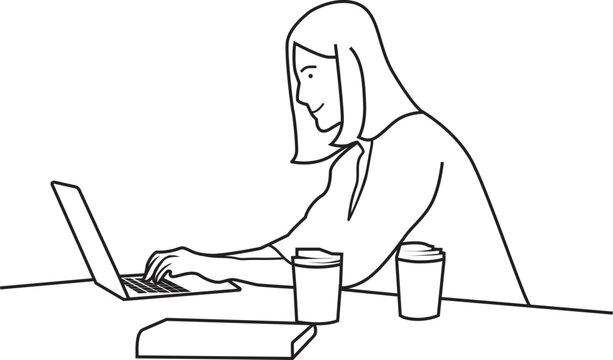 a woman works in front of a laptop and is accompanied by coffee