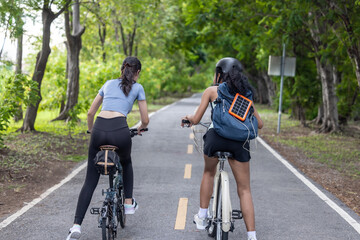 Naklejka premium Biker fuse eco-awareness, cycling for fitness, solar for device power, and recycling into lifestyle