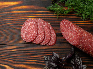 sausage on a dark wood table close-up