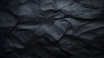 Black crumpled paper texture background 