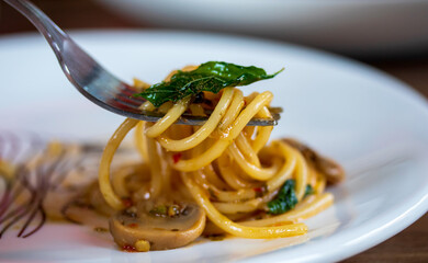 Spaghetti with Spicy Mixed mushroom and basil.Thai fusion food. Healthy food