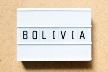 Lightbox with word bolivia on wood background