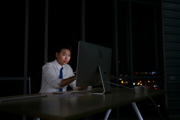 White collar worker working late at night.