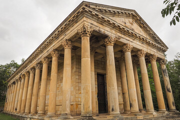 Naklejka premium Neoclassical architecture. Catholic sanctuary Parthenon of Las Fraguas or church of San Jorge, looks like Greek temple with a total of 40 columns around the building. Arenas de Iguña, Cantabria, Spain