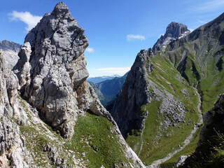 Picturesque slopes of rocky mountains covered with grass. Beautiful natural landscape