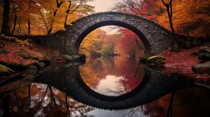 Foto auf Acrylglas Rakotzbrücke Colorful autumn reflection of the bridge in the water. Autumn background