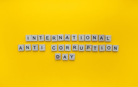 December 9, International Anti-Corruption Day, minimalistic banner with the inscription in wooden letters