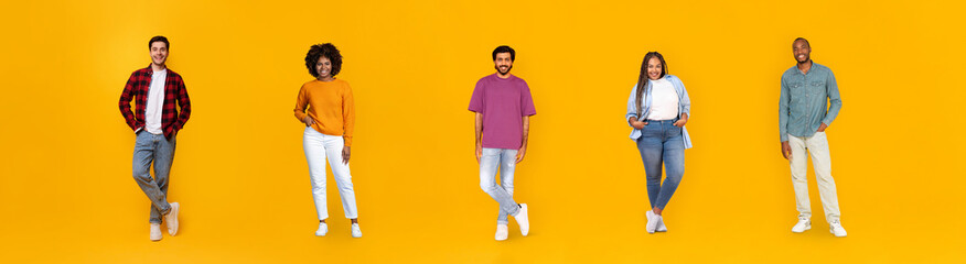 Happy multiethnic millennials posing on orange background, web-banner