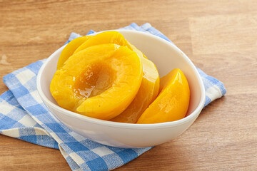 Sweet canned peaches with syrope