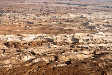 Scenic scenary with sands of Judean Desert Israel , view from a distance. Uneven surface of land in...