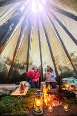 Family in Lappish hut