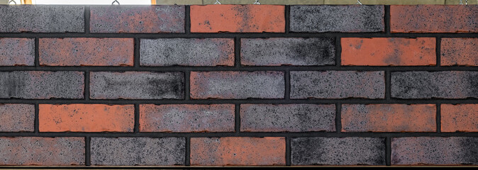 Close up of brick wall, example of facing material. Real photography