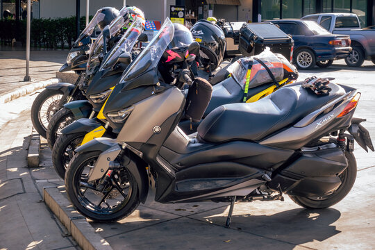 KANCHANABURI, THAILAND - DECEMBER 9, 2019 : Yamaha X-Max 300 big scooter motorbike gang were parking in the line for meeting and gathering after touring together at PTT Gas station.