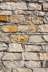 vertical background in the form of natural stonework.