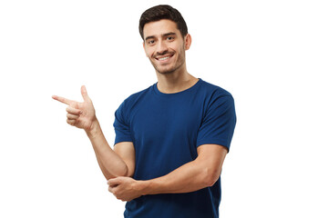 Handsome man in blue t-shirt pointing left with finger - obrazy, fototapety, plakaty