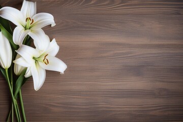 White lily flowers on wooden background. Top view with copy space.Funeral Concept