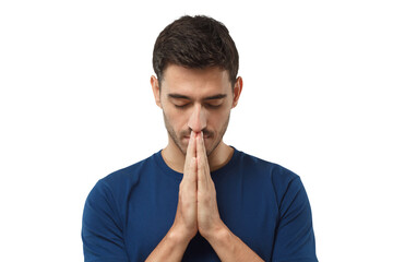 Close-up of young man putting hands together as if he is praying with closed eyes to find solution