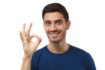 Fototapeta premium Young man showing OK or okay gesture with fingers of one hand