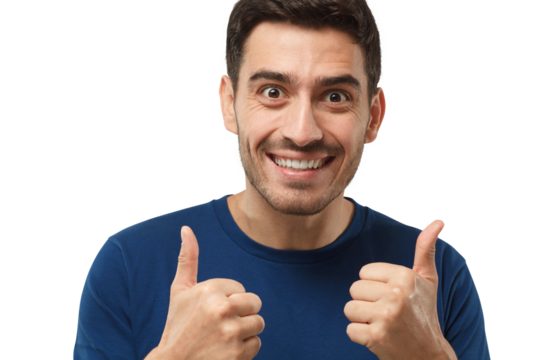 Close-up shot of motivated excited young man making a thumbs up gesture of approval and success with smile