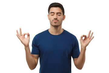 Concentrated relaxed man in blue t-shirt with closed eyes, having relaxation while meditating,...
