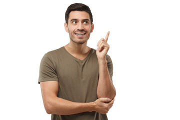 Portrait of young handsome man in t-shirt, pointing his finger in eureka sign, having great idea,...