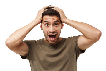 Handsome surprised man looking at the camera, shocked, holding hands on head