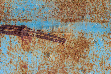 Blue rusted metal background. A rusty and scratched painted metal wall. Rusty metal background with...