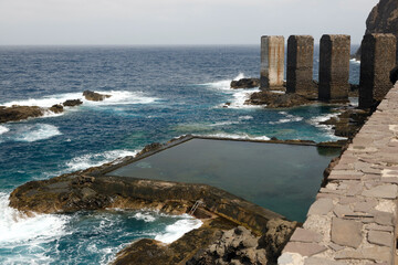 Obraz premium La Gomera, Spain. View of the dilapidated banana loading station in Hermigua, located on the Atlantic Ocean.