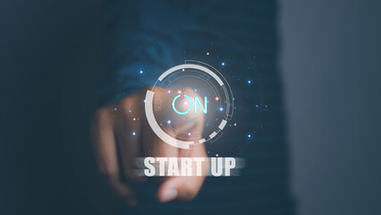 Businessman press button startup business. On button start in new business progress. Start up business concept.