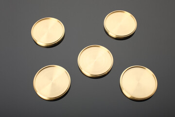 Set of gold coins isolated on black background. Medal with metal texture.