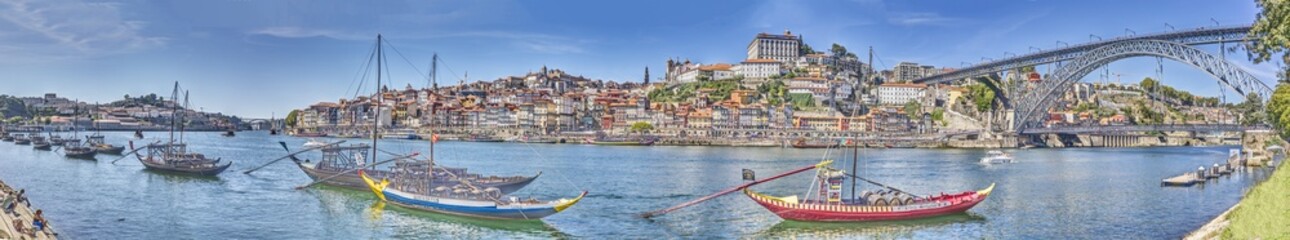 Panoramic view over the Douro River with the city of Porto and the bridge Ponte Dom Luis during the day