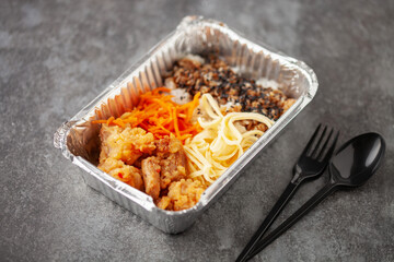 Healthy meal prep container with chicken, rice and vegetable salad. Back to school or lunch time concept. Top view