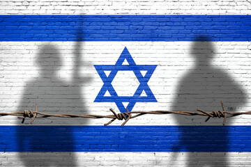 Flag of Israel painted on the brick wall with soldiers shadows. Gaza and Israel conflict. Terrorist organizations hezbollah and hamas