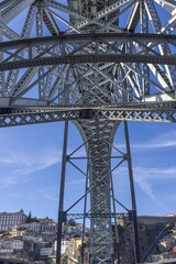 Vertical panoramic image of the load-bearing metal structure of the Ponte Dom Luis bridge during the daytime