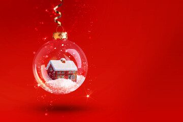 Abstract Christmas decorations, Transparent ball with a house and snow on a red background. Festive...