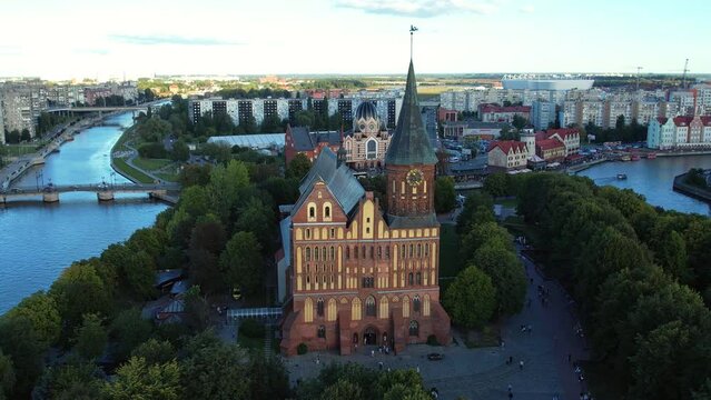 Kaliningrad city aerial shot. Immanuel Kant Cathedral and Museum, drone view. Immanuel Kant Island. Konigsberg at sunset. Pregolya River.
