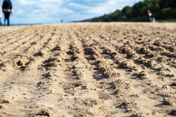 Plowed sea smish shore with people in the background