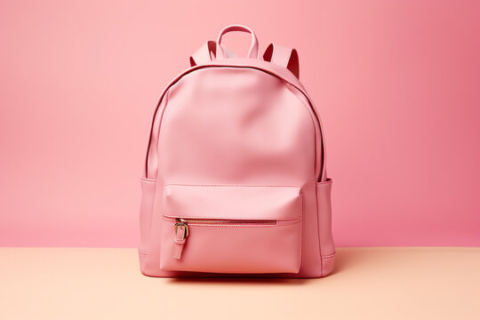 Pink schoolbag, school bag, backpack on desk