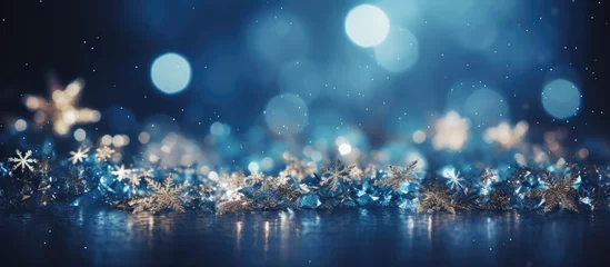 Tuinposter Festive blue background with twinkling stars and snowfall © AkuAku