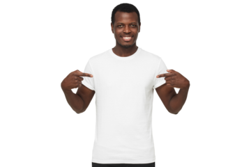 Smiling african american man pointing at blank white t-shirt with both index fingers, copy space for your logo