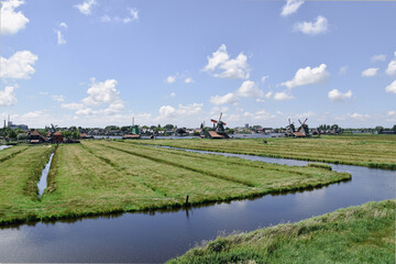 landscape with a windmills, dutch windmill village, netherlands spring