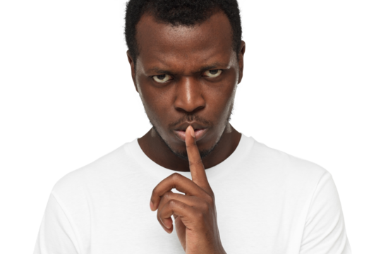 Close-up shot of angry african american man with shhh gesture, asking for silence or to be quiet