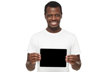 African american man standing in white t-shirt, holding tablet and showing blank screen as mockup