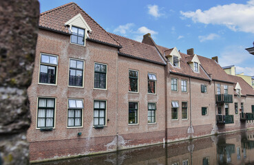 Obraz premium old houses on river, city canal 