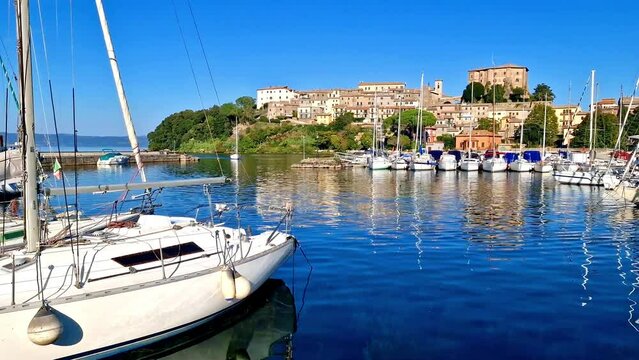 Scenic lakes of Italy - beautiful Lago di Bolsena. 4kHD video of Capodimonte medieval village. Viterbo province, Lazio region
