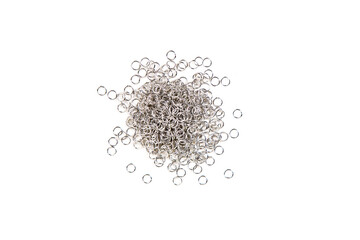Silver colored jump rings in a pile isolated over white top down view